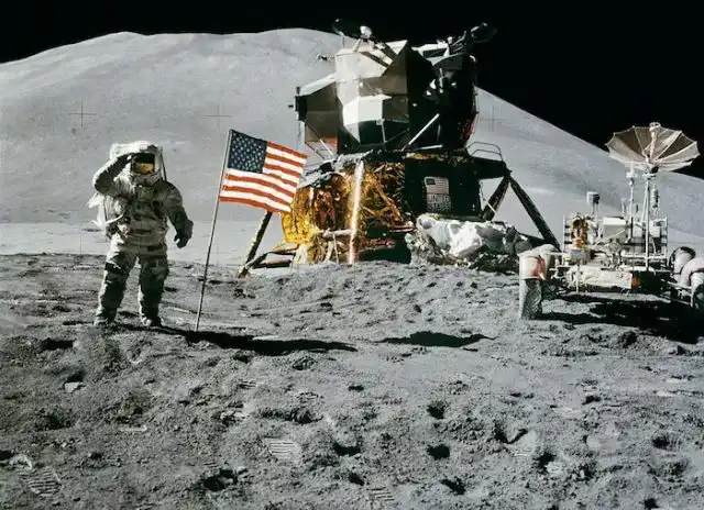 American astronaut James Irvin standing next to the American flag on the Moon during the Apollo 15 mission, 11 August 1971